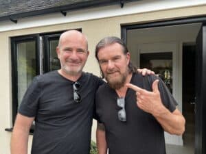 image shows Andy Hollis of 74 people with Billy Duffy of The Cult